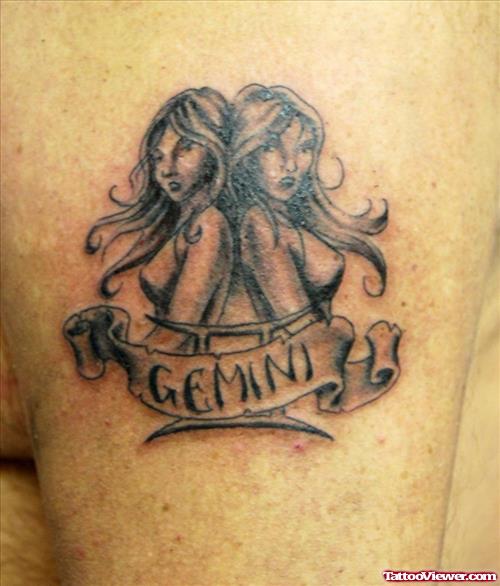 Attractive Grey Ink Gemini Tattoo On Left Shoulder