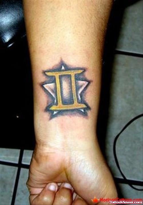 Star And Gemini Tattoo On Left Wrist