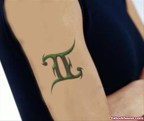 Green Ink Gemini Tattoo On Right Bicep