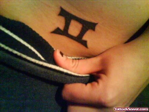 Black Ink Gemini Tattoo On Hip