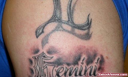 Grey Ink Gemini Tattoo On Shoulder