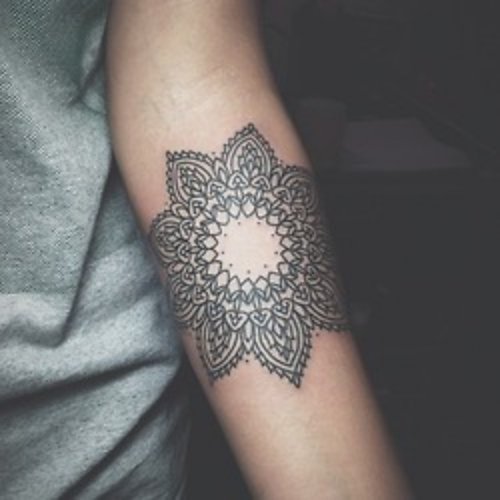 Grey Ink Geometric Flower Tattoo On Forearm