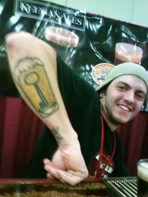 Guy Showing His Beer Glass Tattoo