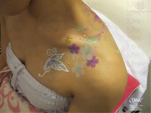 Flowers And Butterfly Glitter Tattoo On Upper Shoulder
