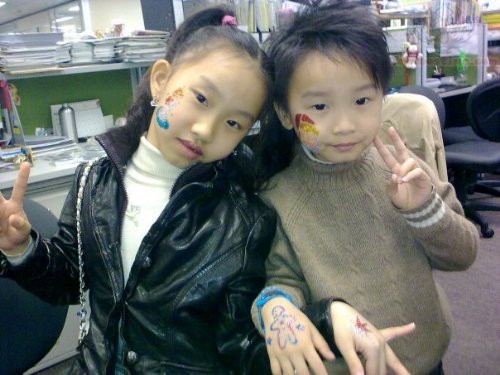 Glitter Tattoos On Childres Hands And Faces