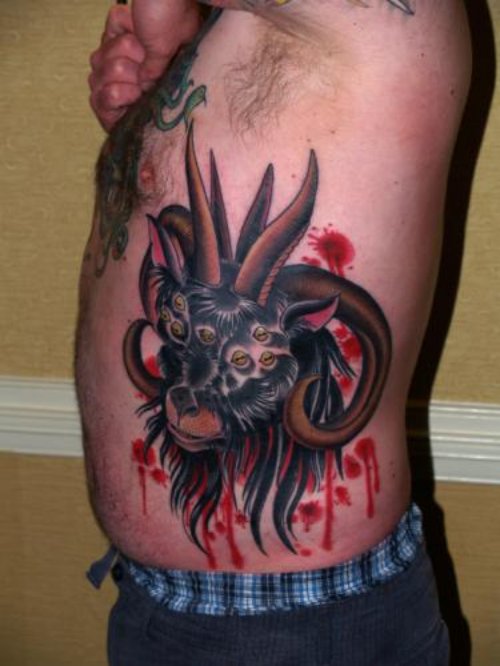 Goat Head With Multiple Eyes Tattoo On Side Rib