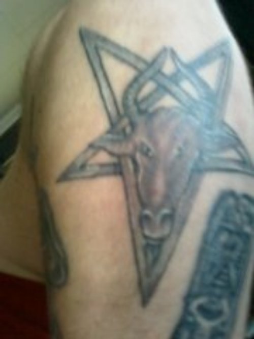 Grey Ink Star And Goat Tattoo On Shoulder