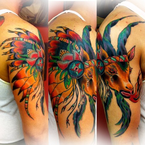 Color Ink Native Feathers And Goat Head Tattoo