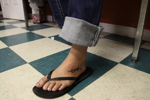 Tribal Goat Tattoo On Left Foot