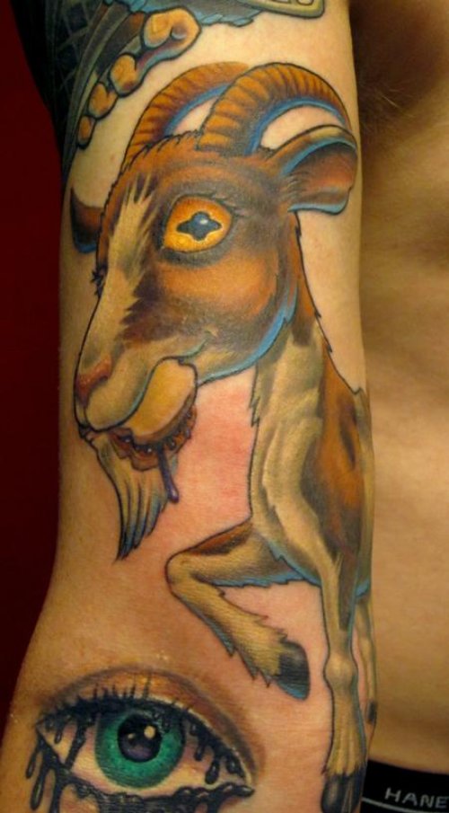 Colored Eye And Goat Tattoo On Half Sleeve
