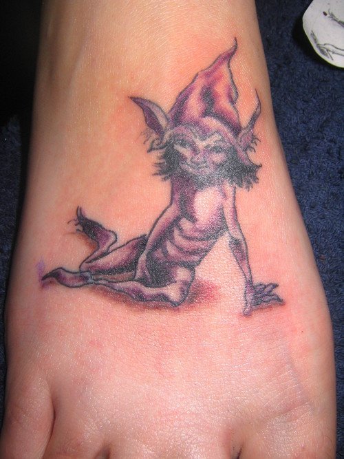 Beautiful Grey Ink Goblin Tattoo On Right Foot