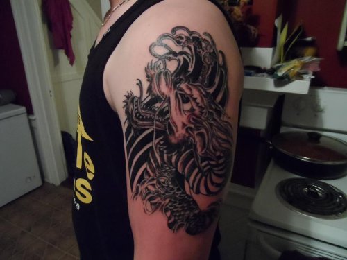 Amazing Grey Ink Goblin Tattoo On Man Left Half Sleeve