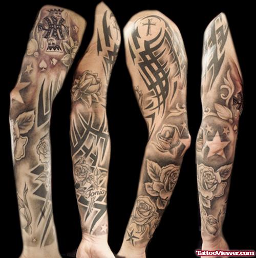 Grey Ink Tribal And Gothic Tattoo On Sleeve