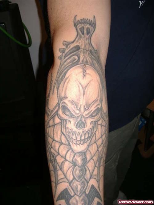 Grey Ink Skull Gothic Tattoo On Sleeve