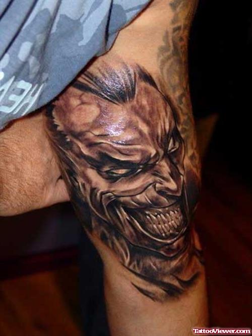 Grey Ink Gothic Skull Tattoo On Biceps