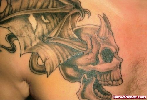 Grey Ink Gothic Skull Tattoo On Man Chest
