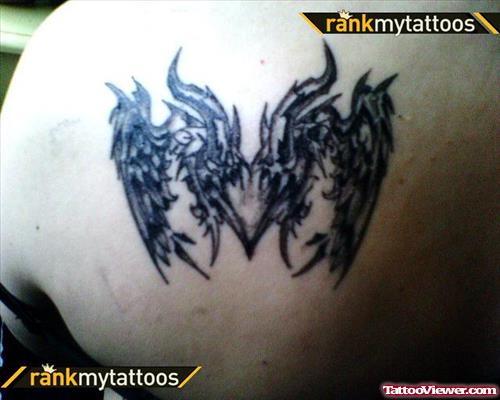 Black Ink Tribal Gothic Tattoo On Left Back Shoulder