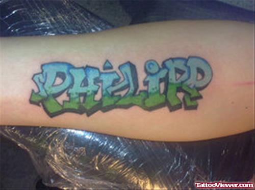 Colored Ink Graffiti Tattoo On Arm