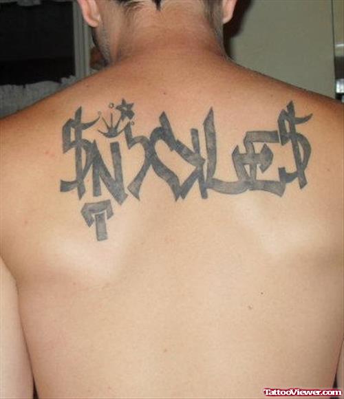 Grey Ink Graffiti Tattoo On Man Upperback
