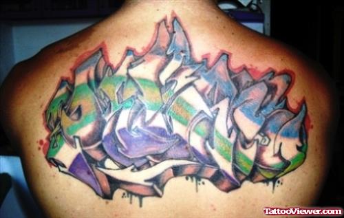 Colored Graffiti Tattoo On Man Upperback