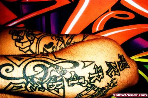Black Ink Graffiti Tattoo On Left Sleeve