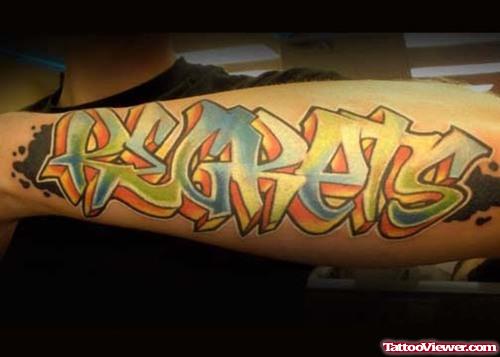 Graffiti Regrets Tattoo On Left Arm