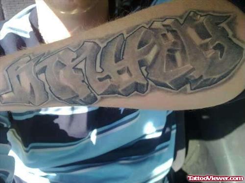 Grey Ink Graffiti Tattoo On Left Arm