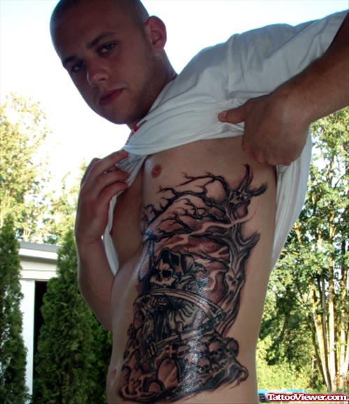 Guy Showing His Graveyard Tattoo On Side Rib