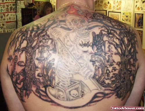 Grey Ink Graveyard Tattoo On Man Upperback