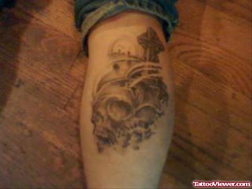 Grey Ink Skull Graveyard Tattoo On Leg