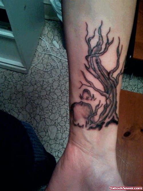 Grey Ink Graveyard Tattoo On Left Wrist