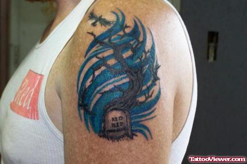 Blue Ink Graveyard Tree Tattoo On Left Shoulder