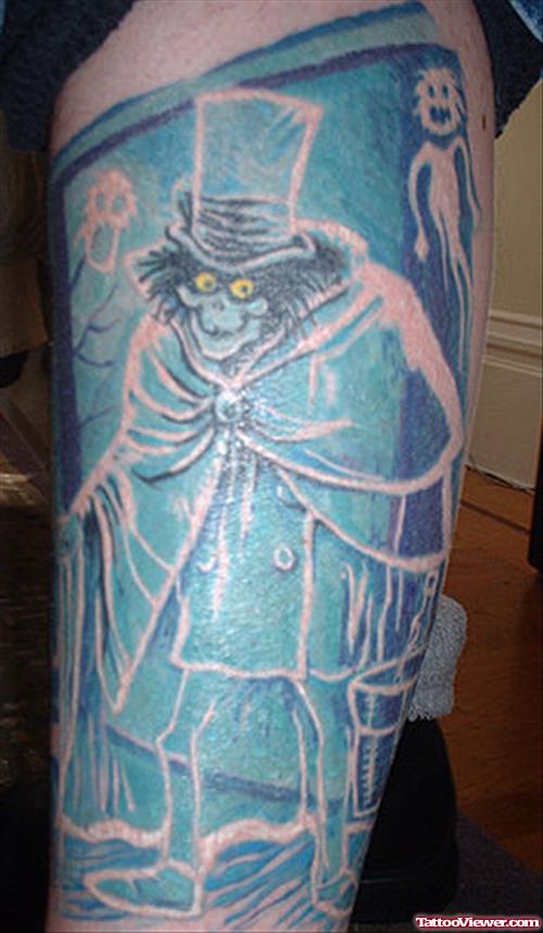 Blue Ink Graveyard Tattoo On Leg