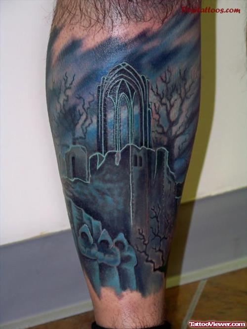 Attractive Blue Ink Graveyard Tattoo On Leg