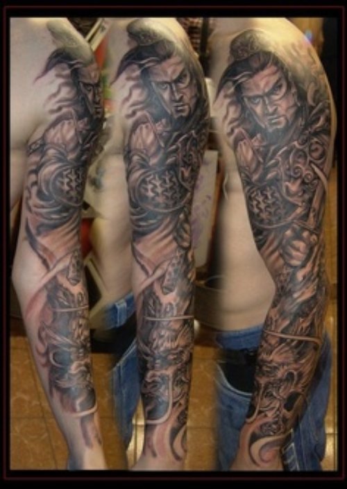 Graveyard Tattoo On Man Left Sleeve