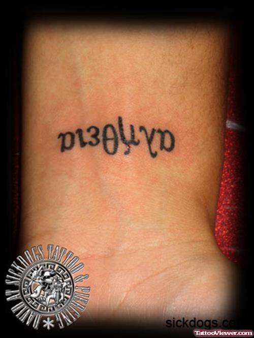 Black Ink Greek Tattoo On Wrist