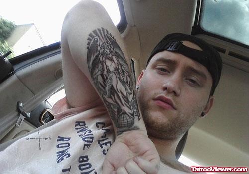 Grey Ink Greek Tattoo On Guy Right Arm