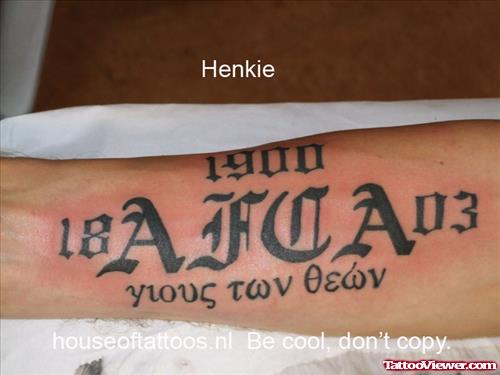 Black Ink Greek Tattoo On Right Forearm