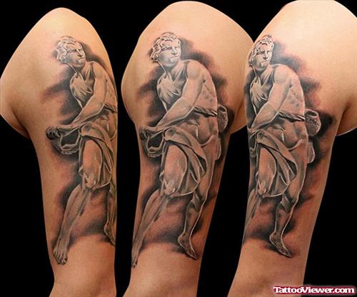 Grey Ink Greek Tattoo On Left Bicep