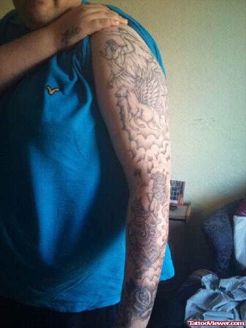 Left sleeve Grey Ink Greek Tattoo For Men
