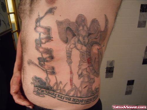 Grey Ink Greek Tattoo On Man Side Rib