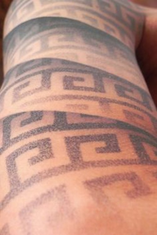 Awful Grey Ink Greek Tattoo On Right Sleeve