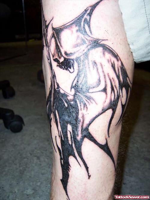 Grey Ink Tribal Grim Reaper Tattoo On Arm