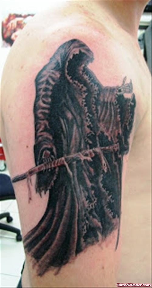Attractive Black Ink Grim Reaper Tattoo On Man Right Sleeve