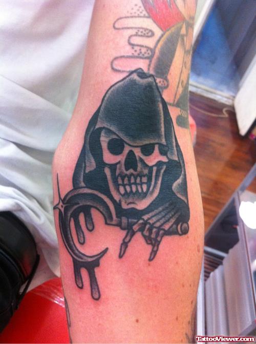 Black Ink Grim Reaper Tattoo On Left Arm