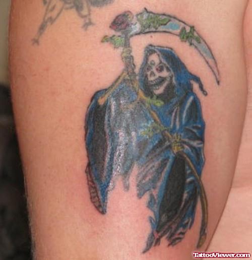 Blue Ink Grim Reaper Tattoo On Bicep