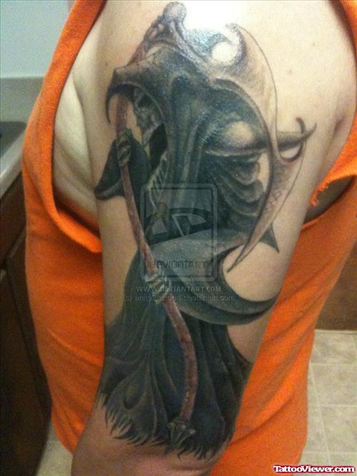Beautiful Black Ink Grim Reaper Tattoo On Left Half Sleeve