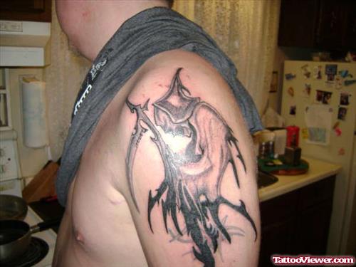 Amazing Tribal Grim Reaper Tattoo On Left Shoulder