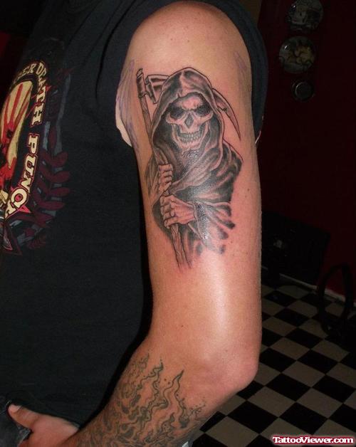 Dark Ink Grim Reaper Tattoo On Left Bicep