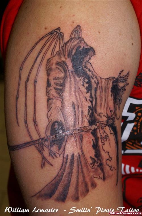 Crazy Grim Reaper Tattoo On Biceps